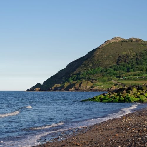 seascape-of-irish-coast-on-sunny-summer-day-in-bra-2023-01-10-01-39-57-utc-scaled.jpg